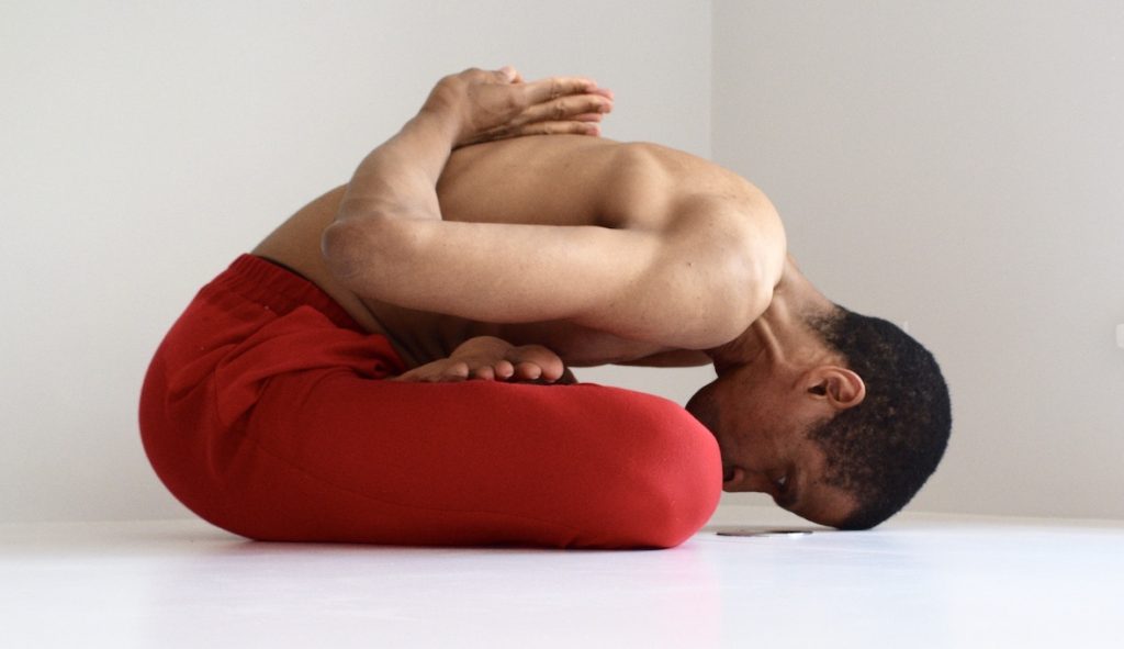 Flexible man doing yoga